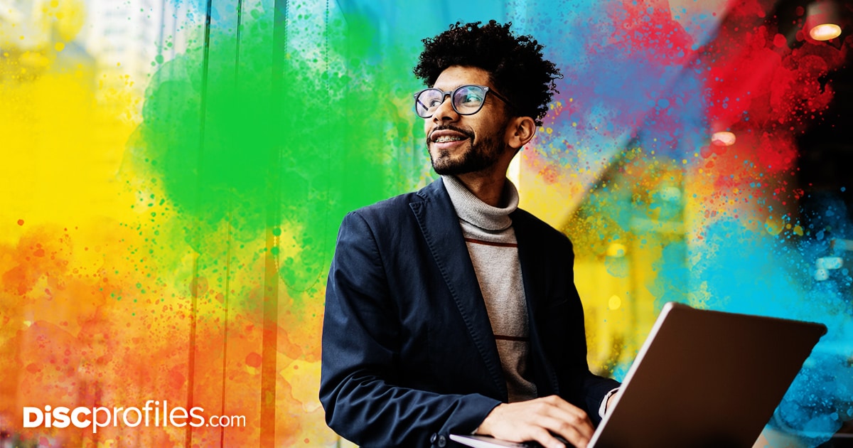 Man looking up from computer, networking on LinkedIn